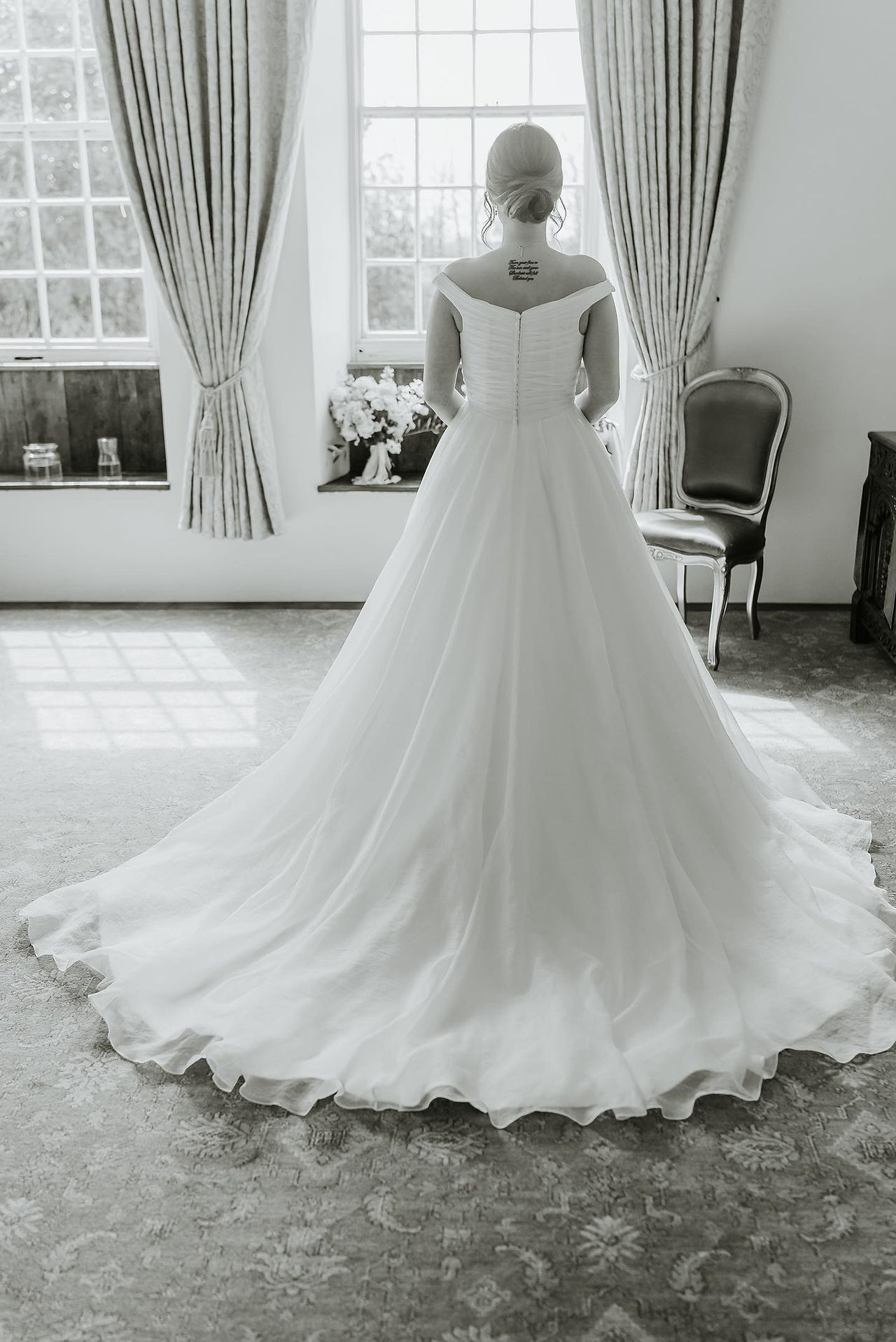 Black and white photo of bride in her Ellis Bridals ballgown