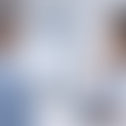 Doctor in a white coat discusses data on a monitor with a patient in a clinic. Charts and graphs are visible. Focused, professional mood.