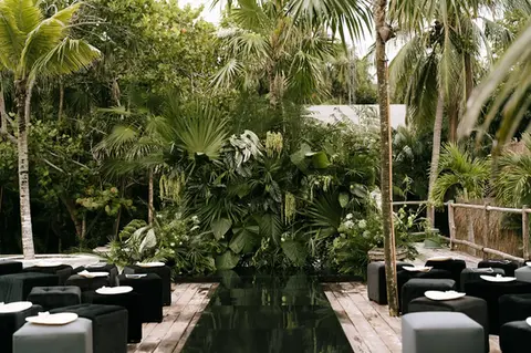 Jungle wedding ceremony setup at luxury destination wedding in Tulum
