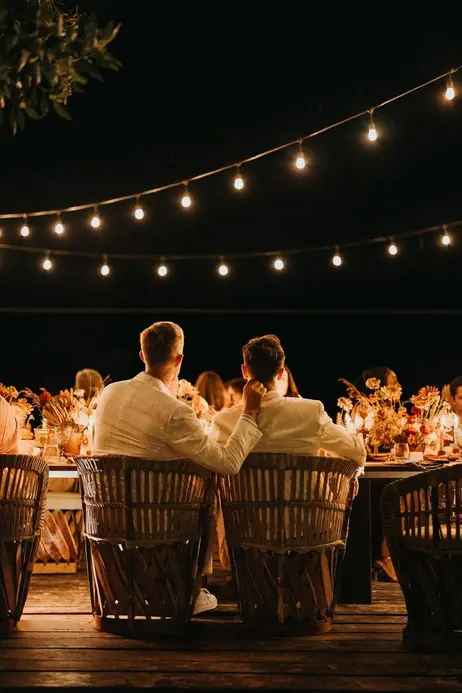 Couple seated at destination wedding dinner in Holbox