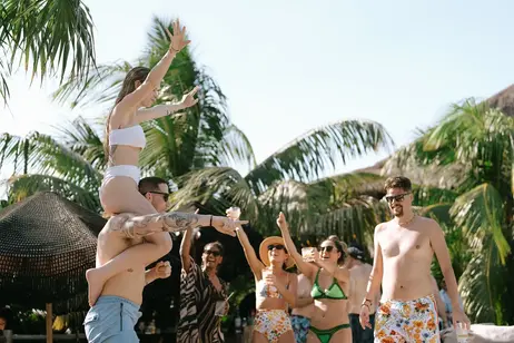 Poolside celebration at luxury destination wedding in Tulum Mexico