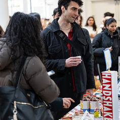 Visitor talking with a vendor at Pomexpo Norooz Bazaar