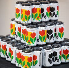 Colorful tulip design cans displayed at Pomexpo Backhomebeer