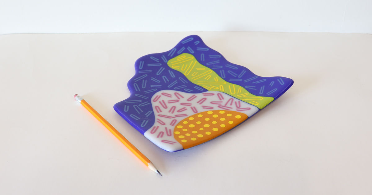 one of a kind kilnformed glass art plate with bright colors and patterns