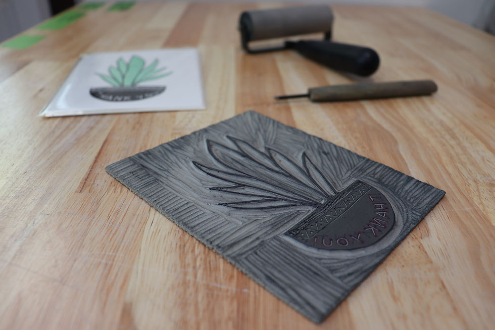 carved linoleum block for snake plant linocut print thank you card with brayer and woodcut carving tool