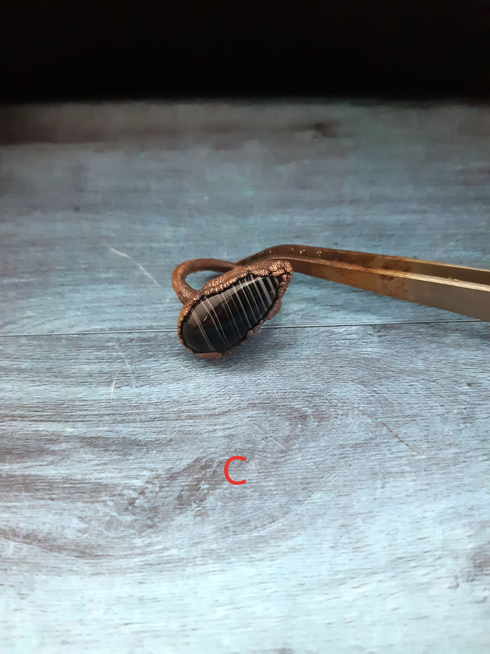 Miniaturbild: Anelli speciali in rame e agata nera