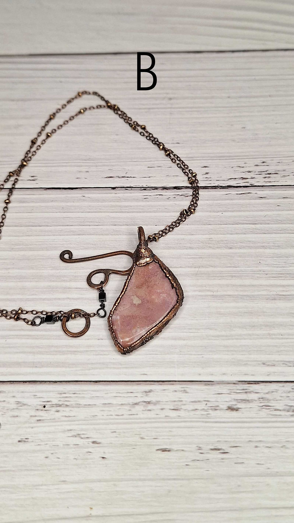Miniature : Ciondoli in rame e pietra di rodonite Svizzera