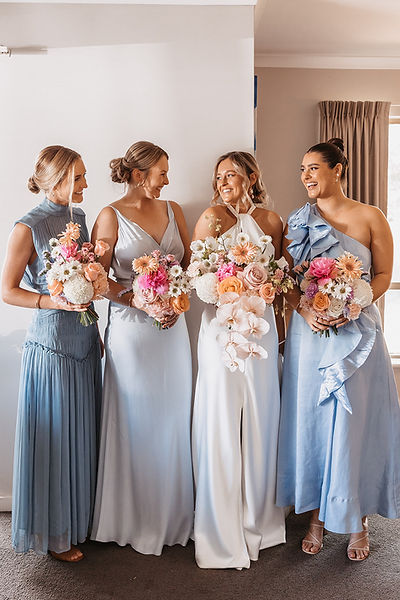 Bridal party with colourful garden-style bouquets at a Henley Brook wedding.