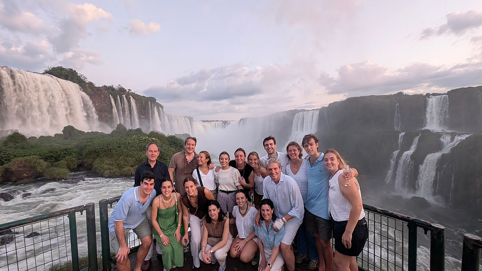 Travelers visiting Iguazu Falls with a local guide during a full-day tour between Brazil and Argentina.