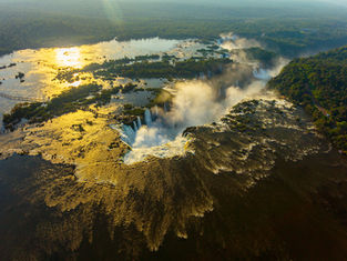 Panoramic view of Iguazu Falls surrounded by Atlantic rainforest on the Brazil–Argentina border.