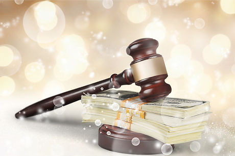 Wooden gavel with money, close-up view.j