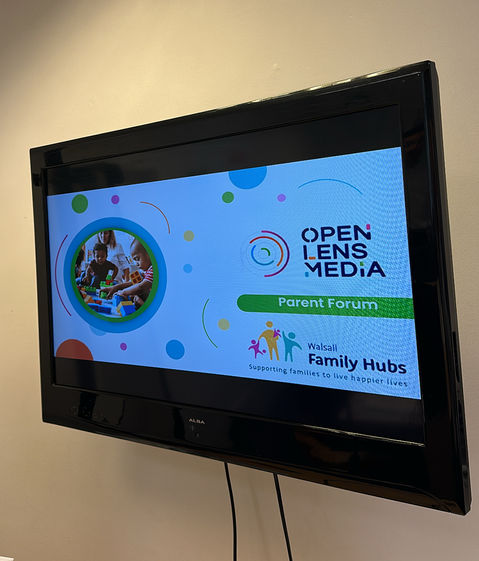 TV screen with a presentation slide showing for the Parent forum