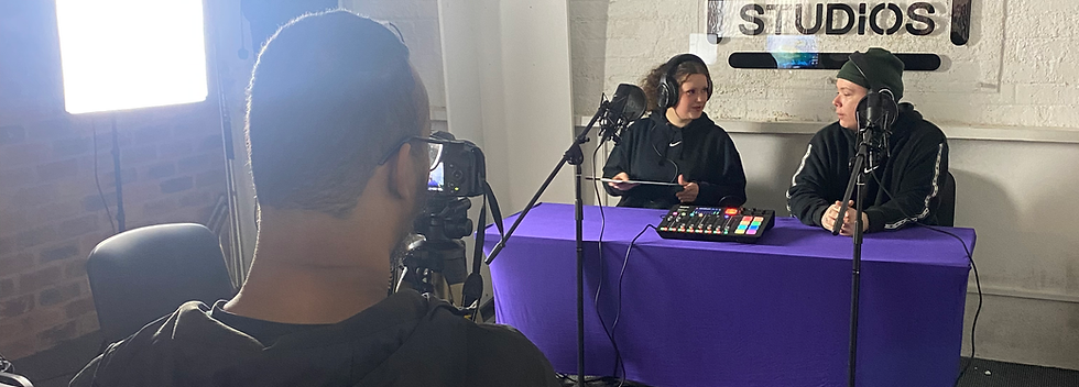 Participants filming and recording a podcast at a podcast desk