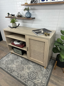 Bespoke wood cabinet:  custom wood record storage cabinet has a beautiful natural stain with a real cane door panel