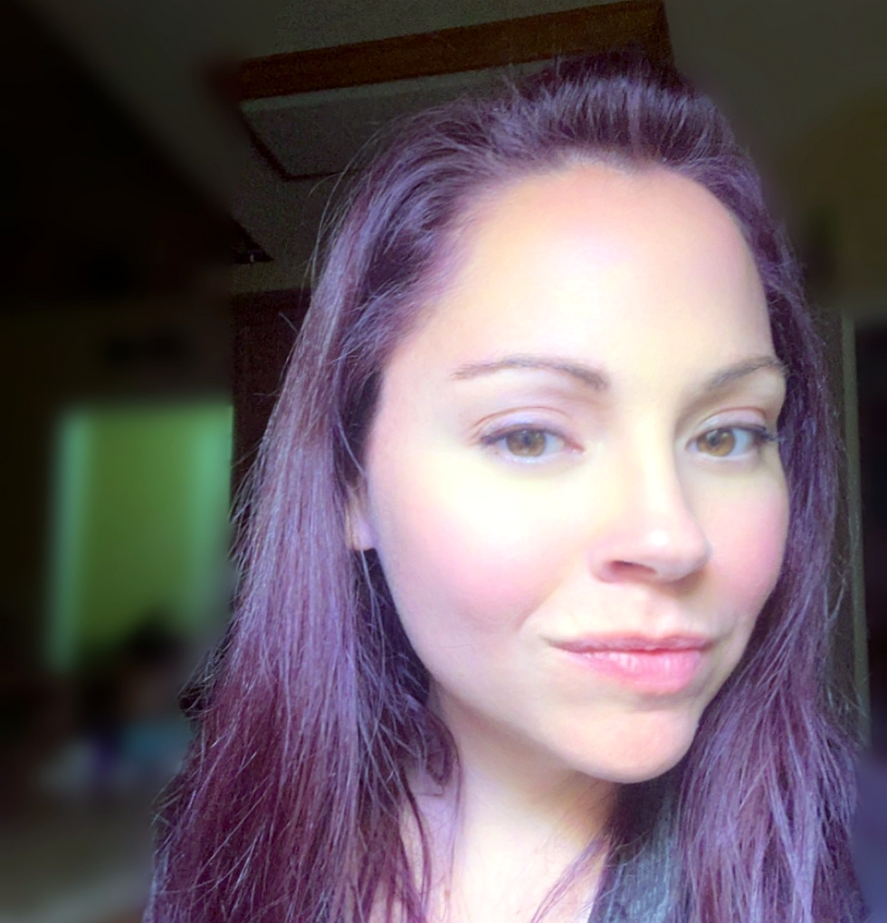 Ashley Talbot with long hair, owner of Talbot Aesthetic Recovery