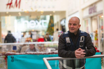 shopping centre staff in equipment vest