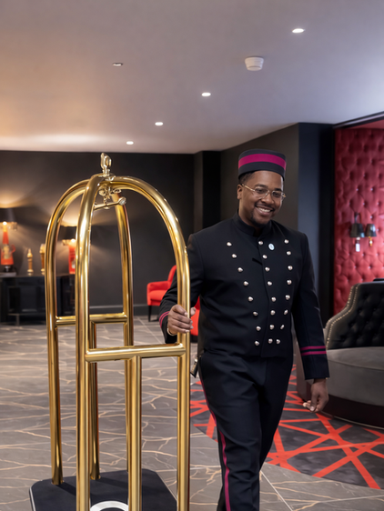 bell boy bespoke black and red uniform with bell boy hat