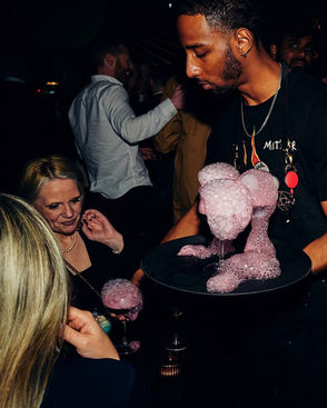 serving drinks in premium bespoke apron