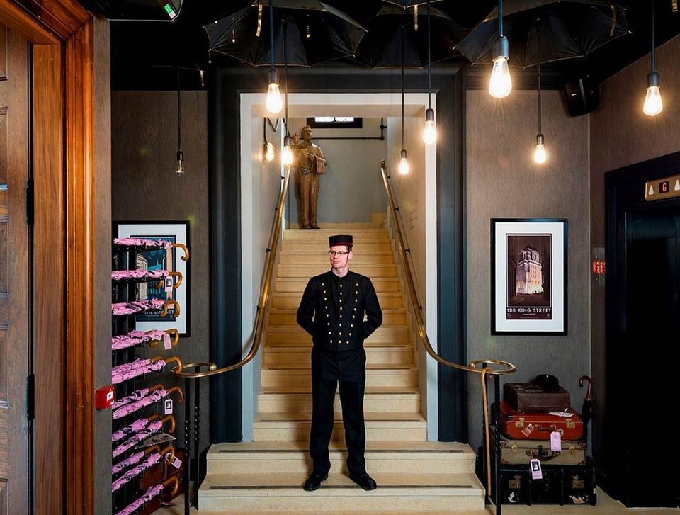 bell boy at hotel gotham in smart uniform