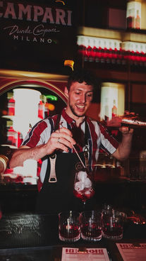 alchemist serving in custom apron for work uniform