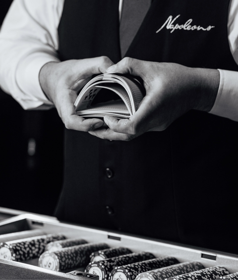 casino staff with cards in waistcoat uniform