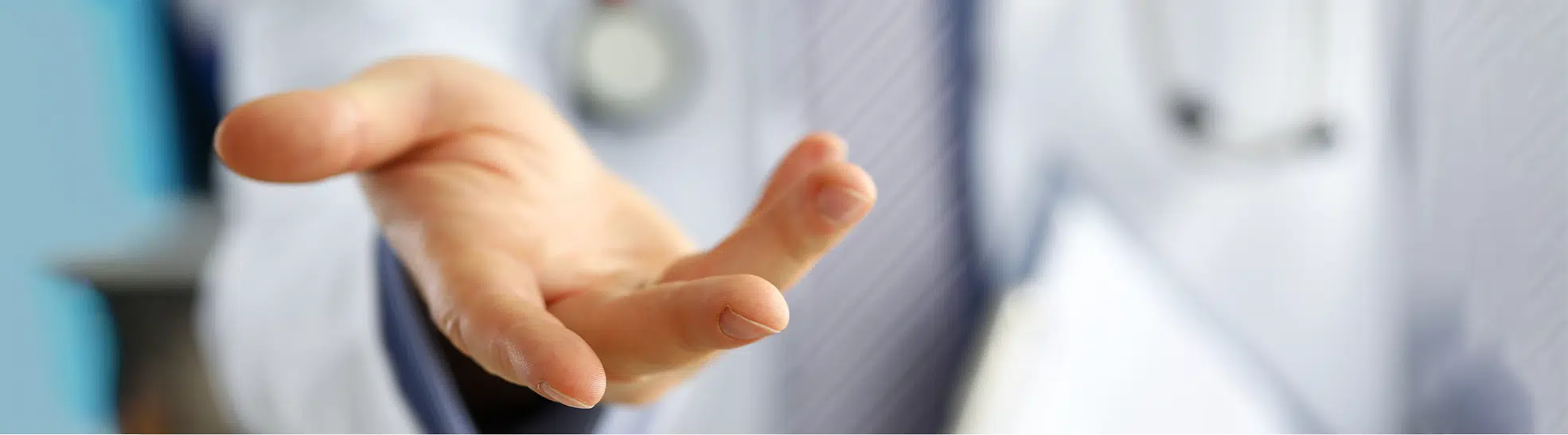 Male medicine doctor offering helping hand close up copy