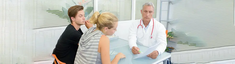 Doctors clinic with man and woman discussing inpatient or outpatient options