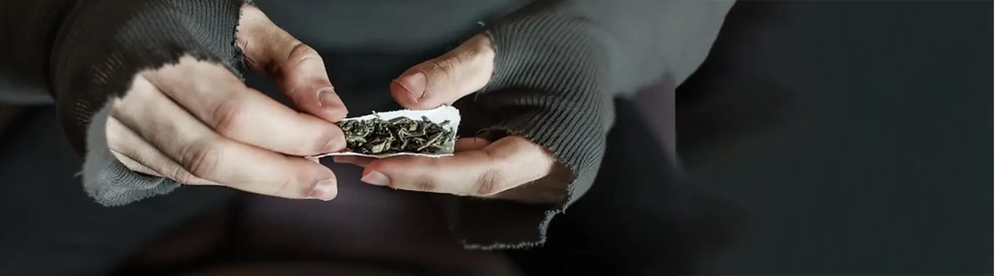 Addict hands making marijuana jamb copy