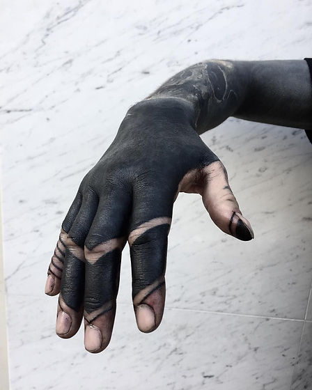 These Striking Solid Black Tattoos Will 