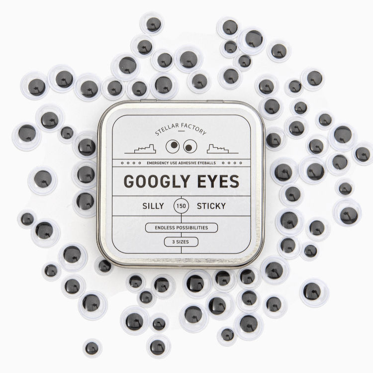 googly eyes scattered on a white background