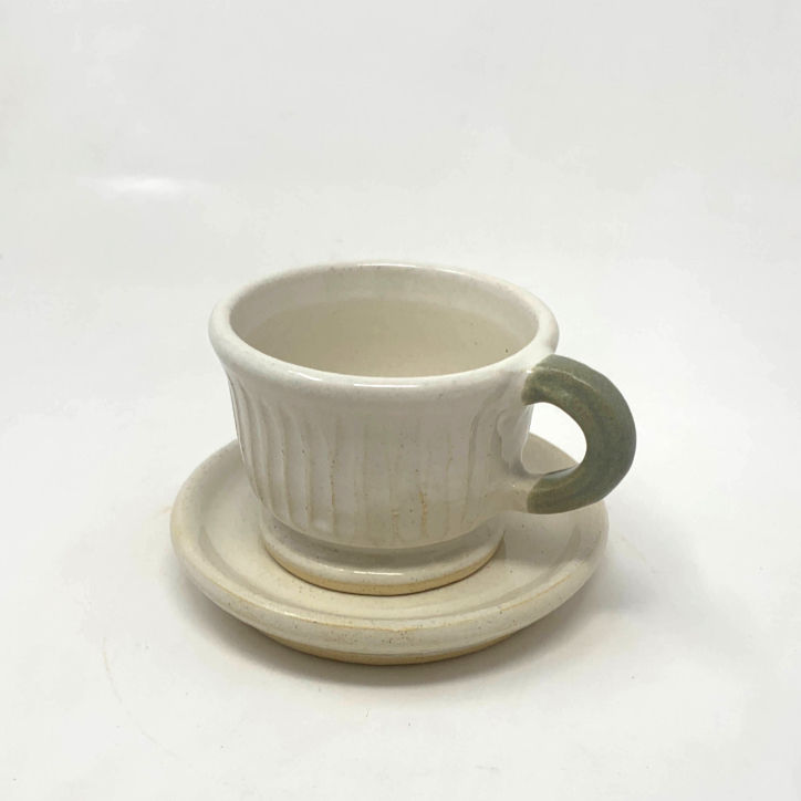 white stoneware double espresso cup and saucer