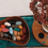 Thumbnail: wooden bowl of crayon rocks in fall colors on teal backround
