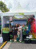 Clean Mahanakorn team member at an environmental awareness exhibition booth.