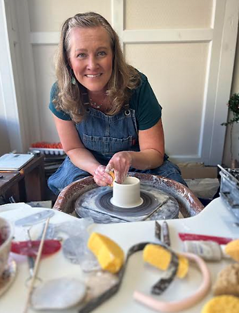Nicki Degeneffe throwing pottery