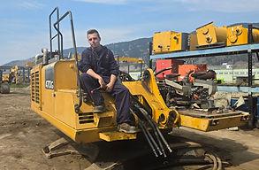 John Deere 470G excavator being dismantled for used and rebuilt parts