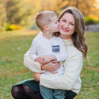 little boy gives mother a kiss