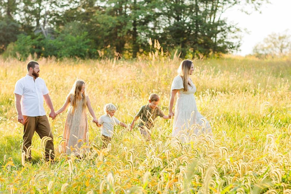 Family walks through fields at Fishers Battlefield in Strasburg.
