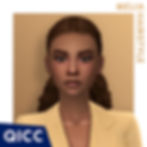 A sim with brown hair in a ponytail wearing a yellow jacket.