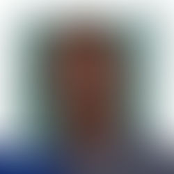 A male adult sims with braided hair, wearing a blue mesh shirt.