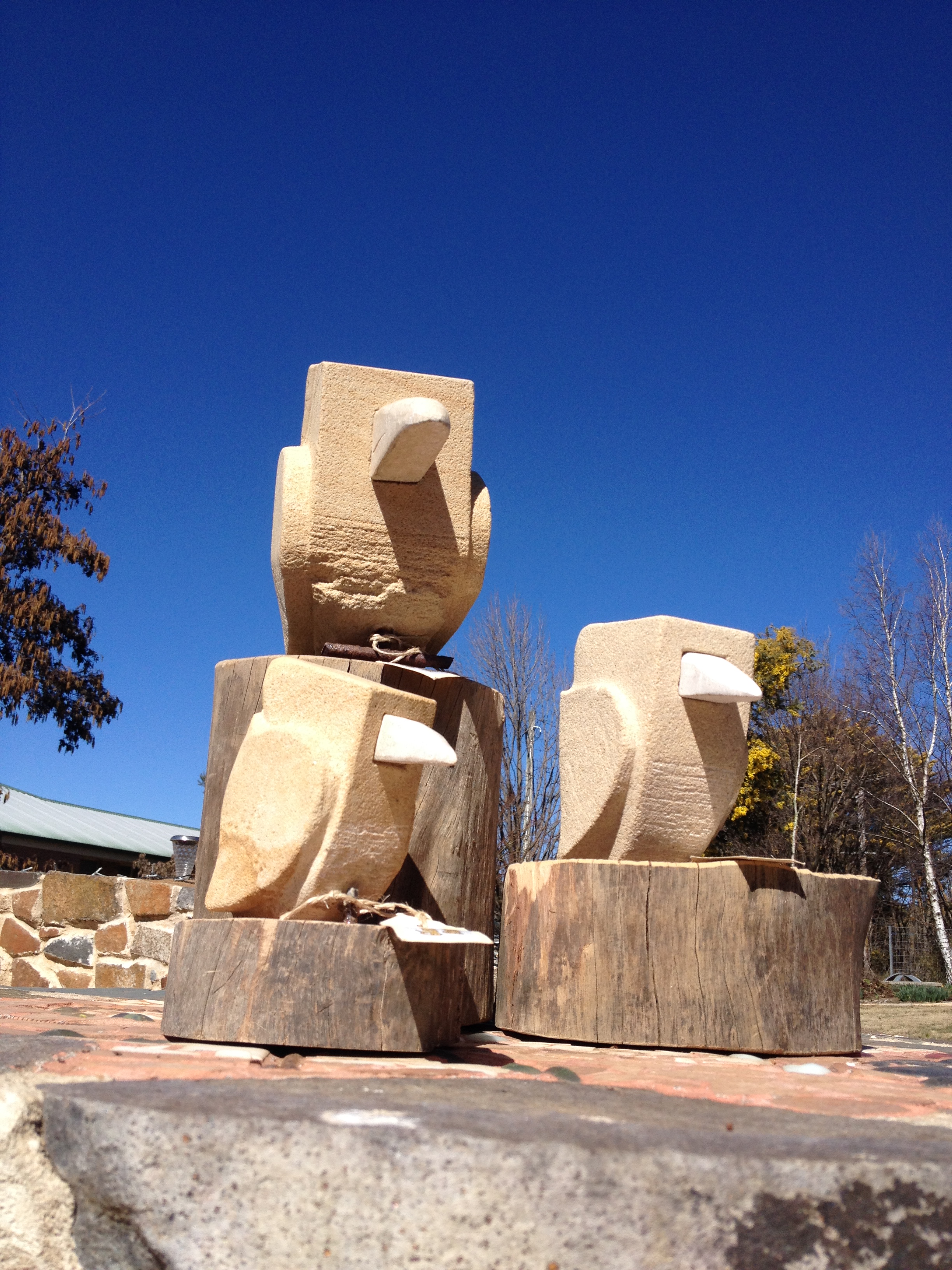 Sandstone Kookaburras on timber base