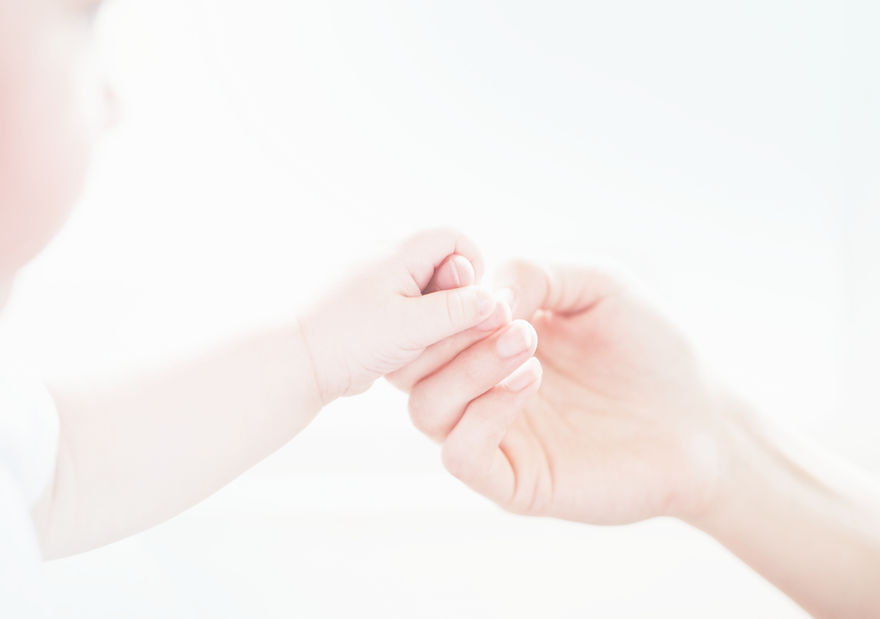 Baby and hand holding_edited.jpg