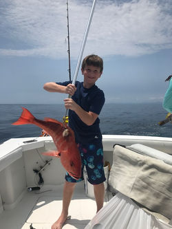 Young boy with big fish