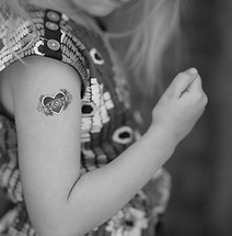 selective focus photo of girl with heart