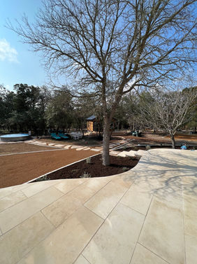 West Oak Hill Austin, TX, Limestone patios wrap around this beautiful home, bringing ample opportunities for the family to gather and entertain. 