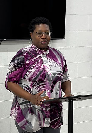 Joy Scott speaking at a podim