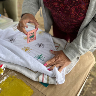 woman's hand, block printing fabric.  Block Print Class