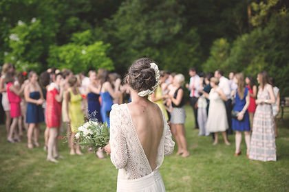 Bride and guests in the garden at large wedding venue