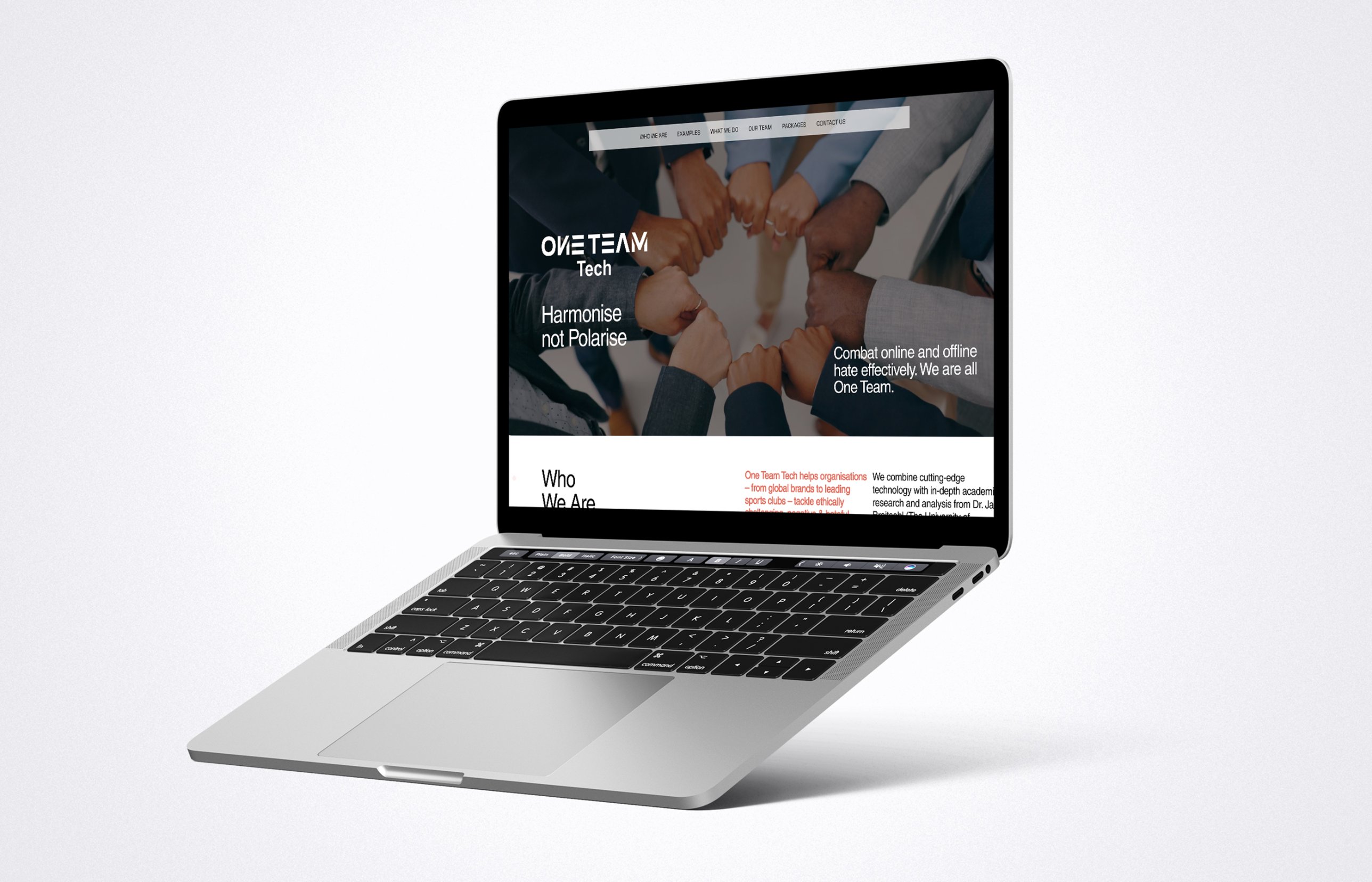 One Team Tech website homepage on a laptop