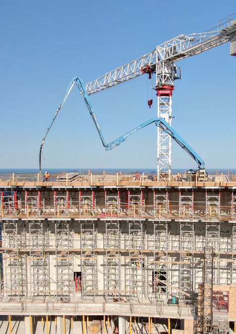 Close-up view of JCL Concrete Pumping completing a roof slab pour at Water’s Edge at The Cove on the South Etobicoke waterfront, showcasing precise concrete placement, skilled operators, and reliable high-rise construction support for major residential developments in Etobicoke and the GTA.