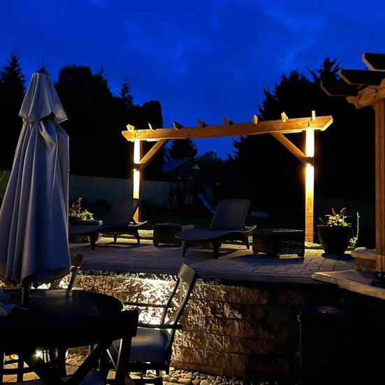 Luxury Poolside Patio with Multi-Level Lighting Design